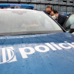 Pla general del conseller d’Interior, Joan Ignasi Elena, visitant un dels nous vehicles dels Mossos d’Esquadra presentats al Complex Egara – Imatge d’Albert Segura Lorrio – ACN